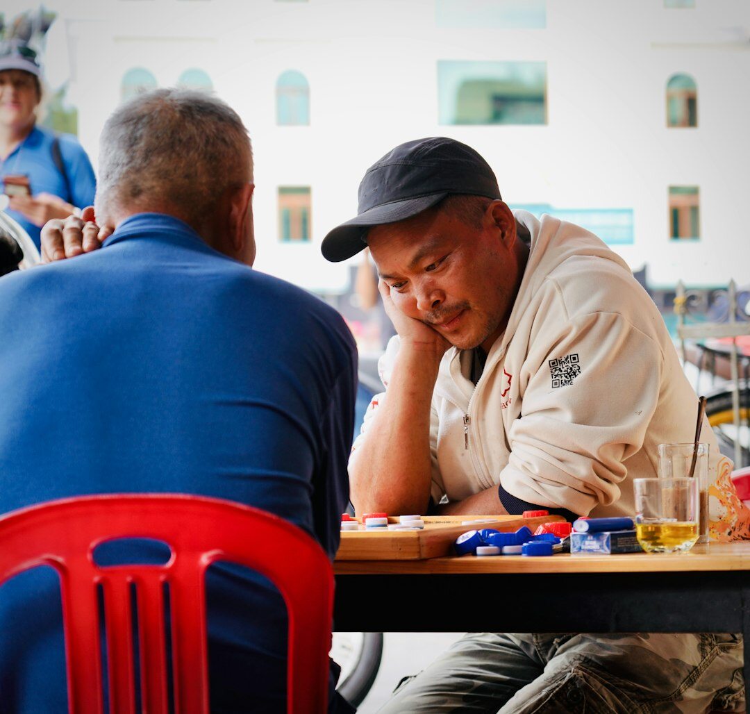 Seniors playing a board game together at a table