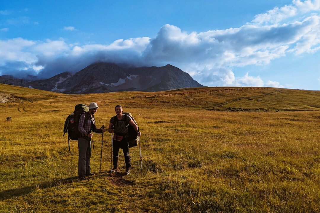 Group of senior tourists hiking in nature