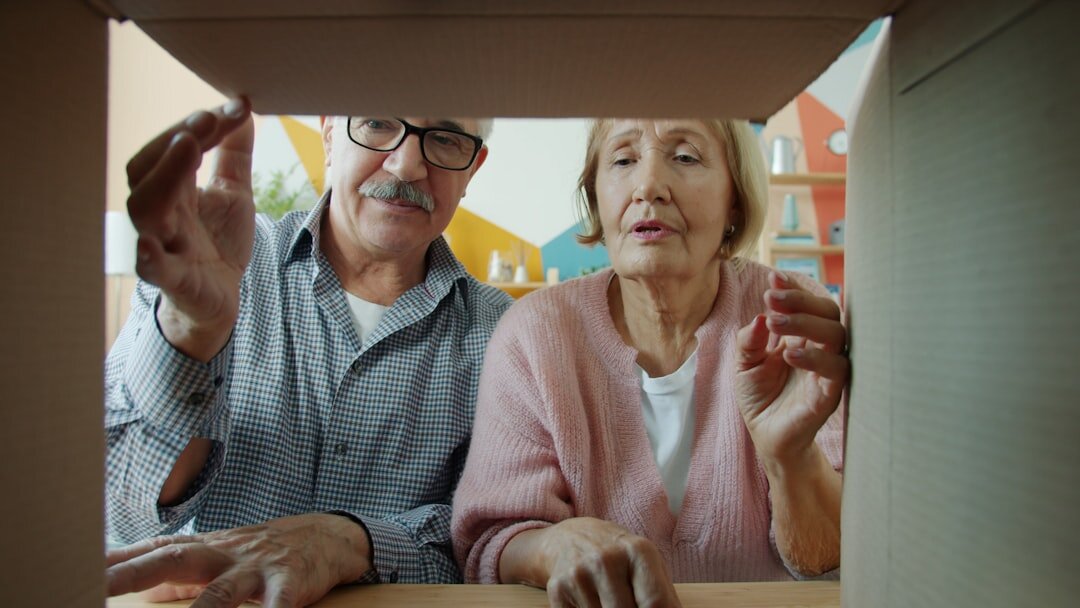 Senior couple reviewing documents together at home