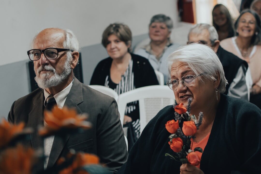 group of elderly people laughing at event
