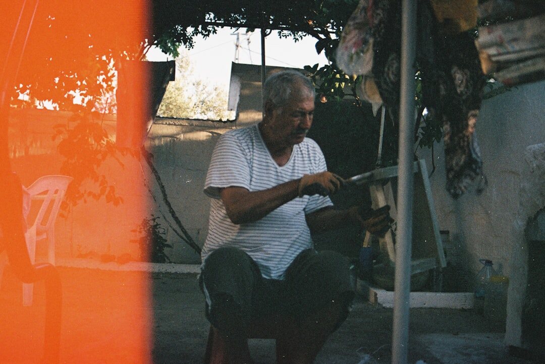 elderly man painting